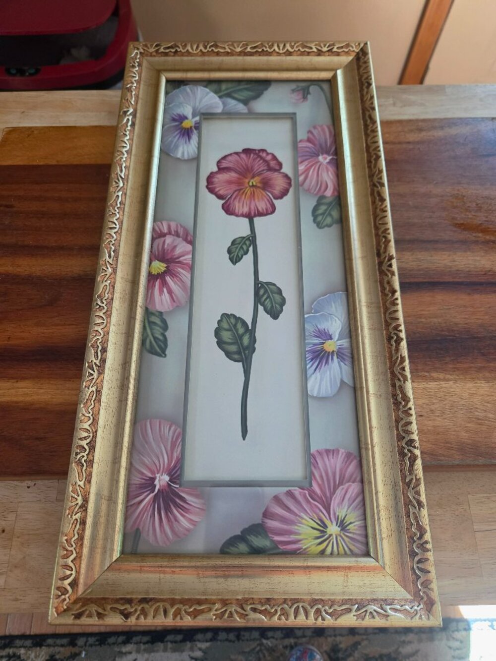 vertical framed floral art features painted pink pansies in gold frame